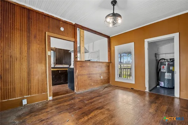 a view of a kitchen with a sink and a refrigerator