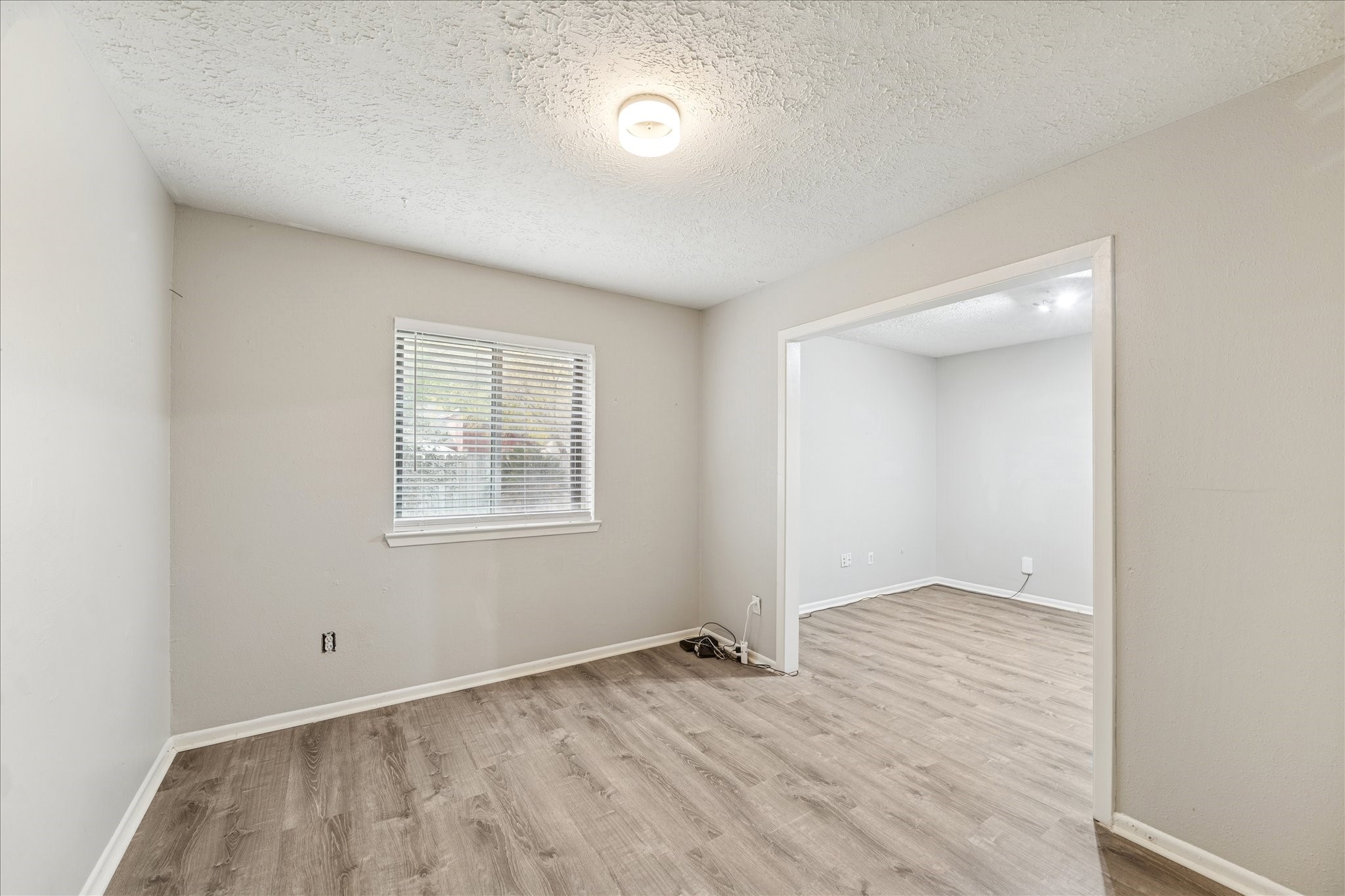 3503 Willie Way Spring, TX 77380 - Photo 12 of 20 an empty room with wooden floor and windows