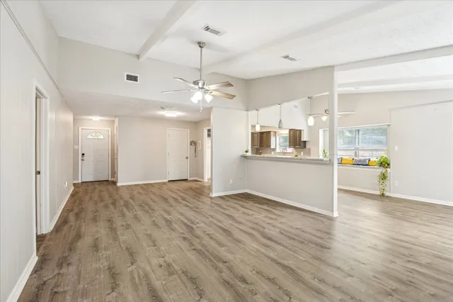 a view of a kitchen with a stove cabinets and wooden floor