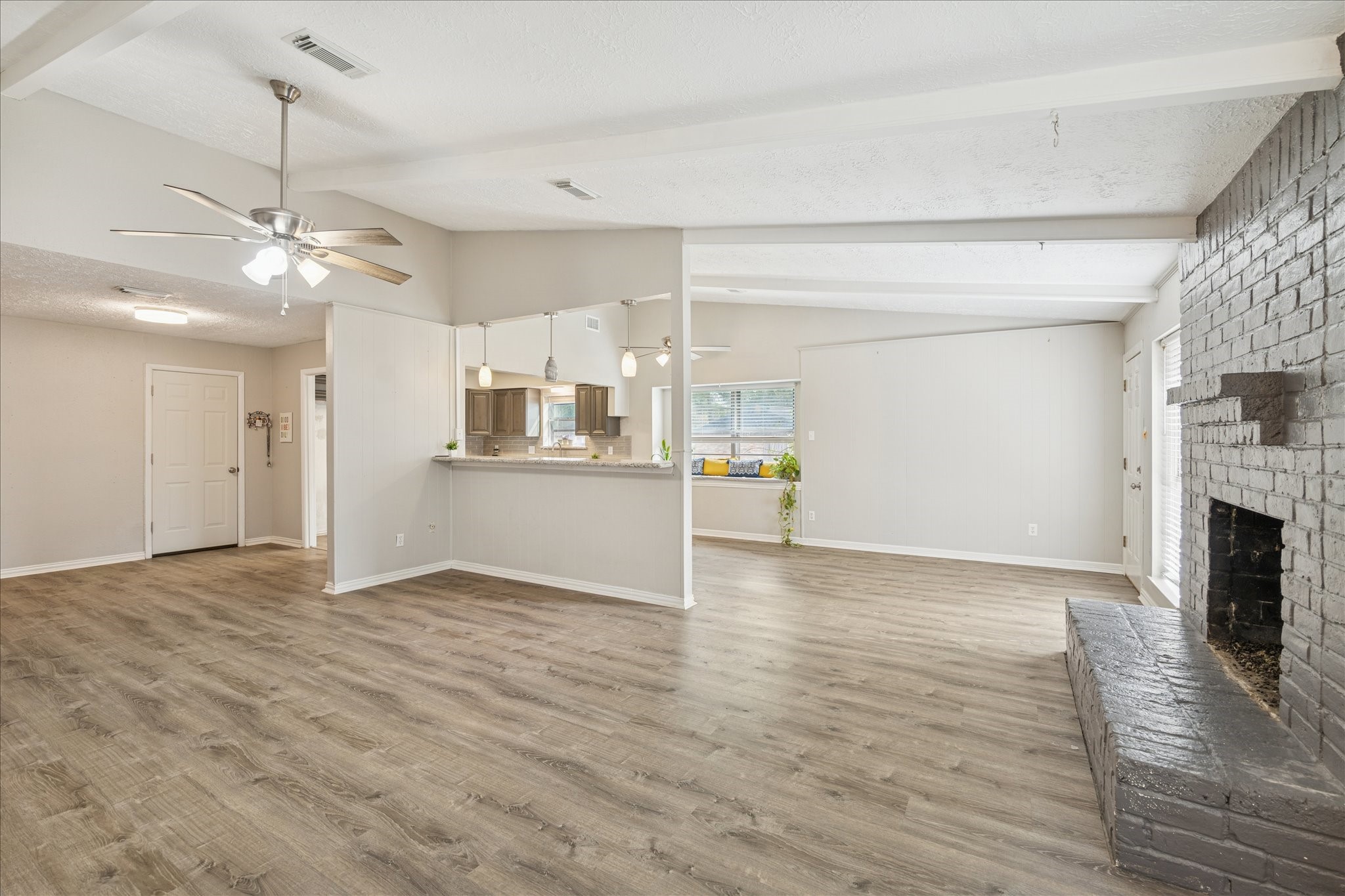 3503 Willie Way Spring, TX 77380 - Photo 5 of 20 a view of a kitchen with a stove cabinets and wooden floor
