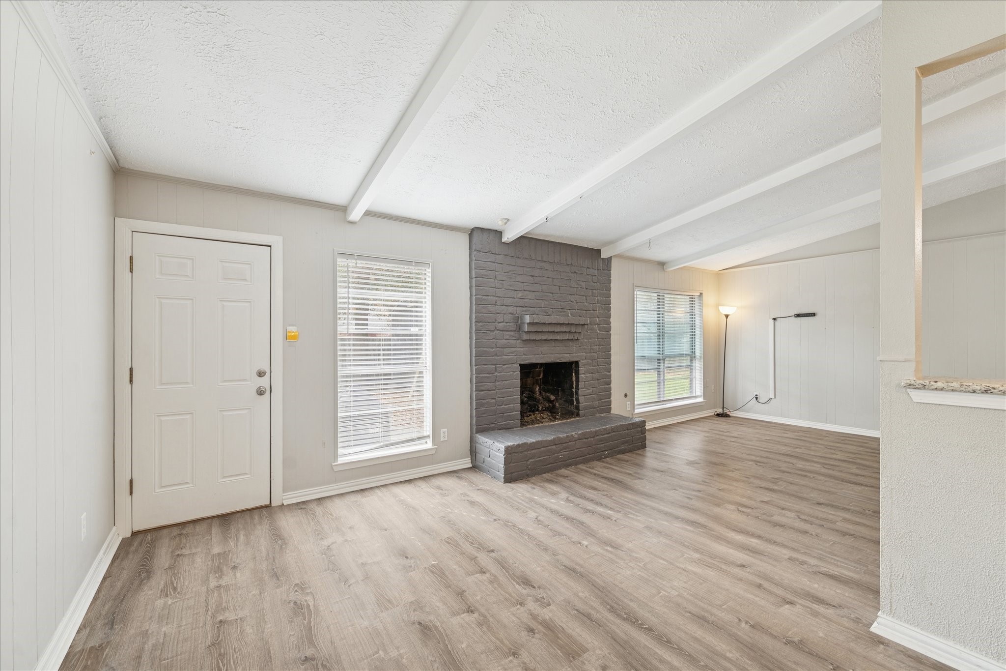 3503 Willie Way Spring, TX 77380 - Photo 6 of 20 a view of an empty room with a fireplace and a window