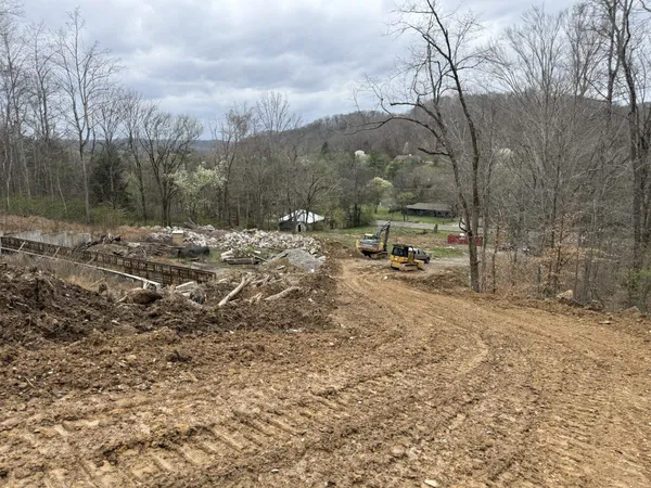 a view of swimming pool next to a yard