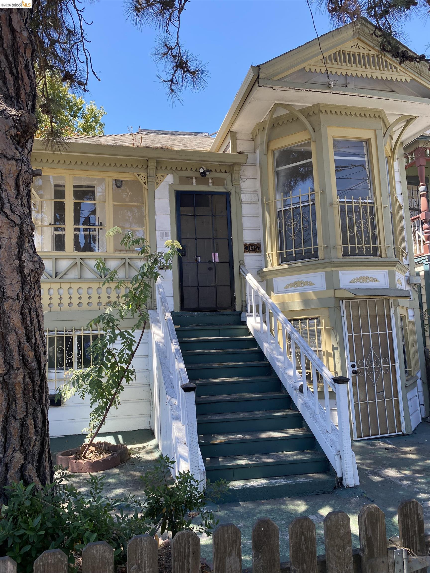 1133 Wood Street Oakland, CA 94607 - Photo 3 of 25 Victorian-style facade featuring ornate trim detailing and a bay window