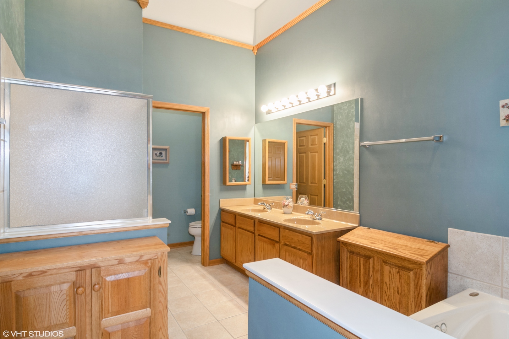 312 Quarry Ridge Circle Sugar Grove, IL 60554 - Photo 10 of 23 a bathroom with a double vanity sink a mirror and a
