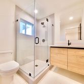 a bathroom with a shower and a toilet