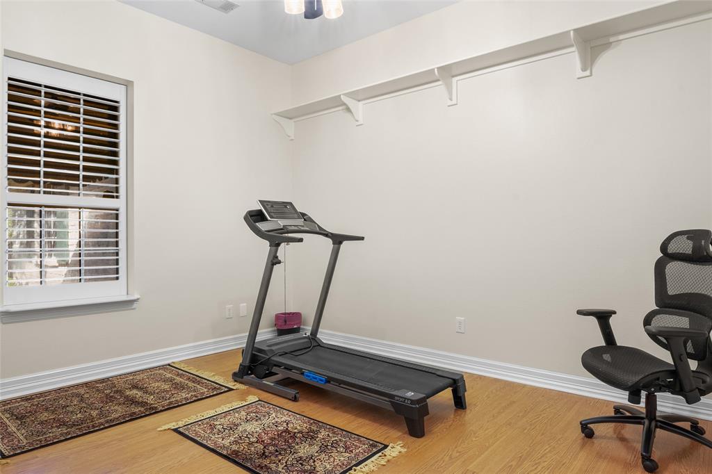 4451 Shiloh Road Midlothian, TX 76065 - Photo 21 of 39 Bedroom number 4 has 10 foot ceilings and planation shutters.