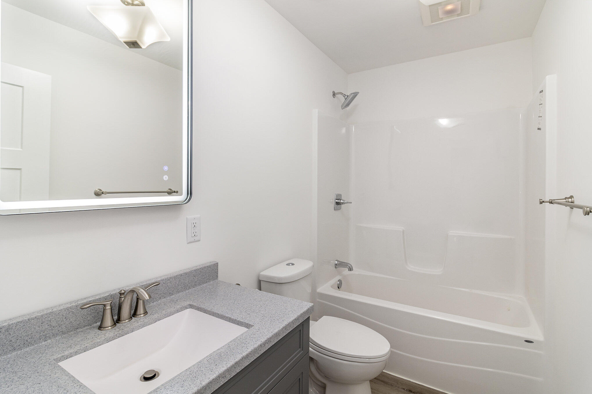 44 Vick Tree Lane Hebron, IN 46341 - Photo 16 of 29 a bathroom with a sink toilet vanity and shower