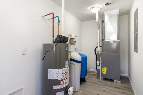 a view of an entryway with wooden floor