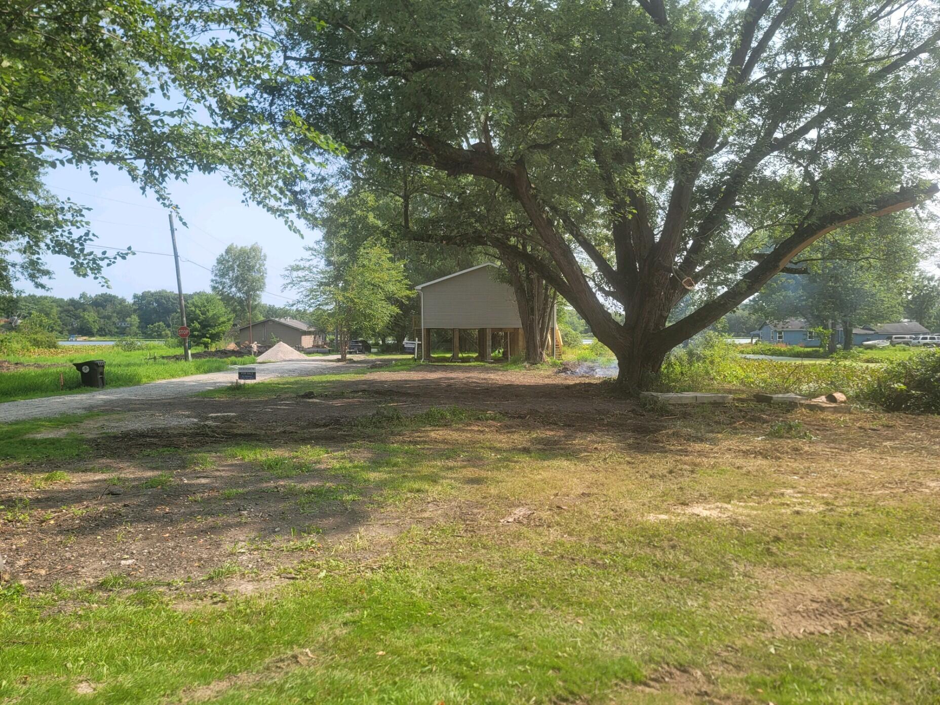 44 Vick Tree Lane Hebron, IN 46341 - Photo 27 of 29 a view of pool with tree s
