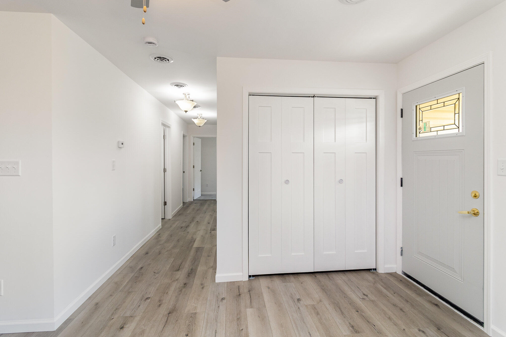 44 Vick Tree Lane Hebron, IN 46341 - Photo 7 of 29 a view of a hallway with wooden floor