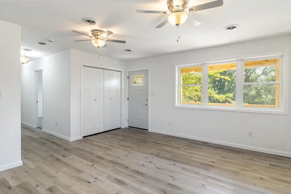 a view of an empty room with a window