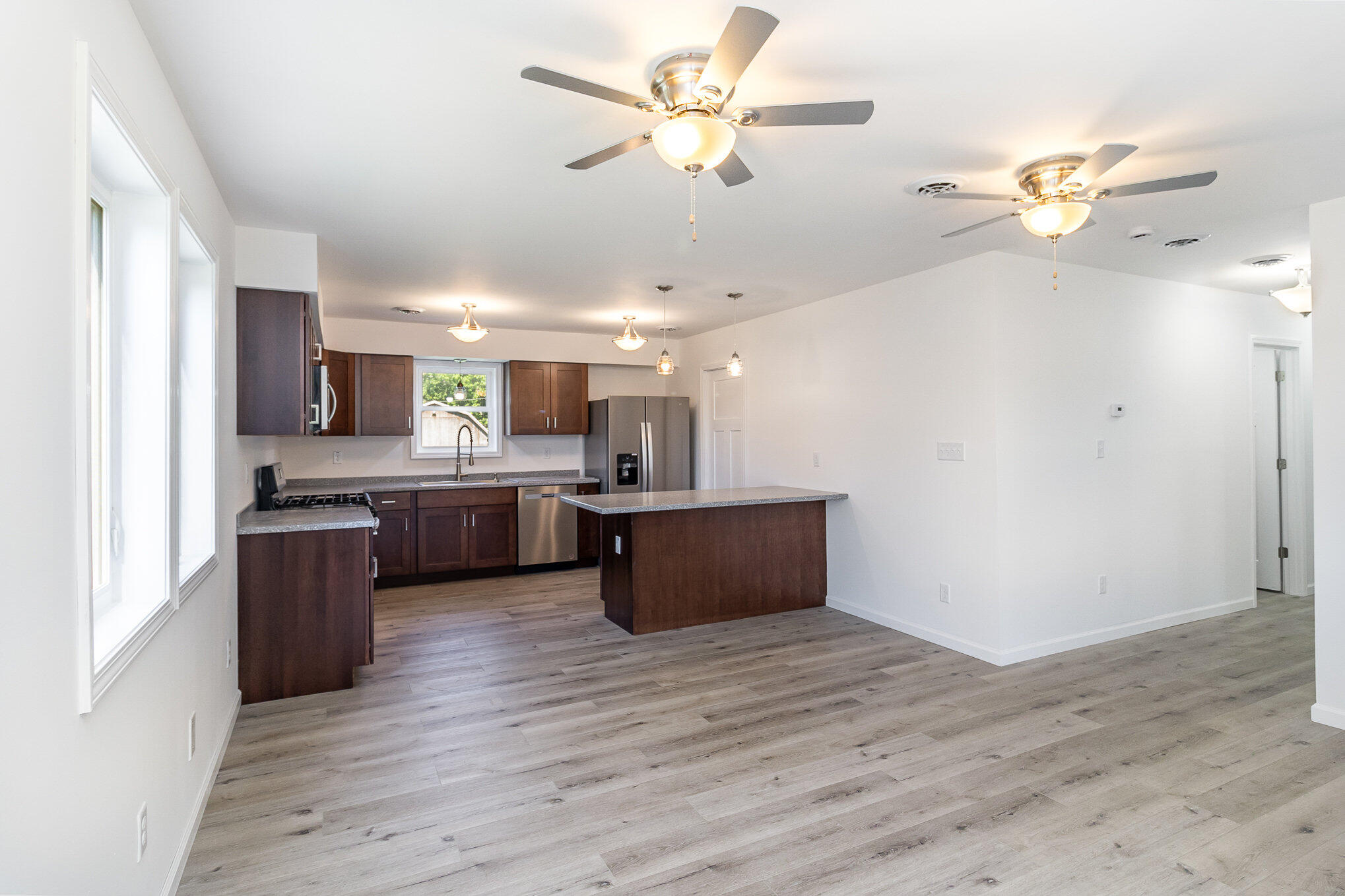 44 Vick Tree Lane Hebron, IN 46341 - Photo 10 of 29 a kitchen with a refrigerator and a sink