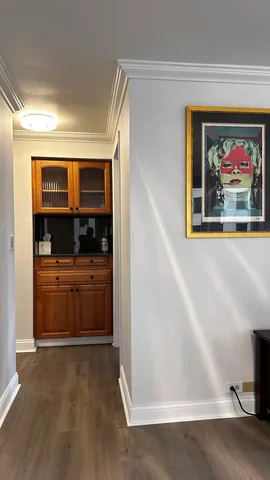 a large bed sitting in a bedroom next to a window