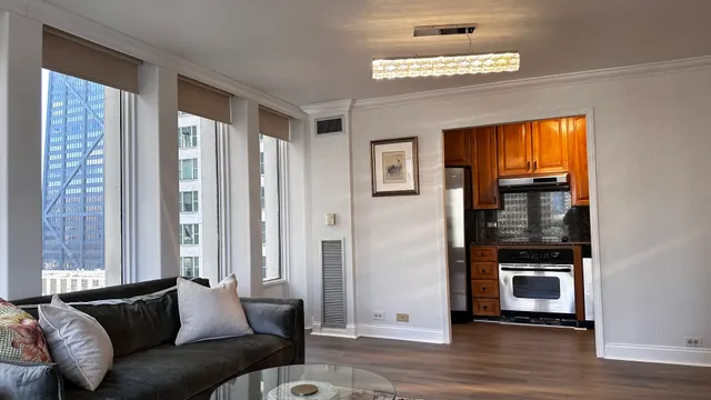 a living room with furniture and a window