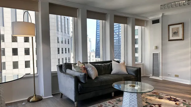 a living room with furniture and a window