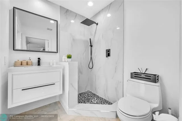 a living room with furniture and a mirror