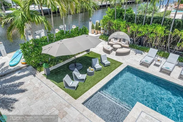 a bedroom with a large bed and wooden floor