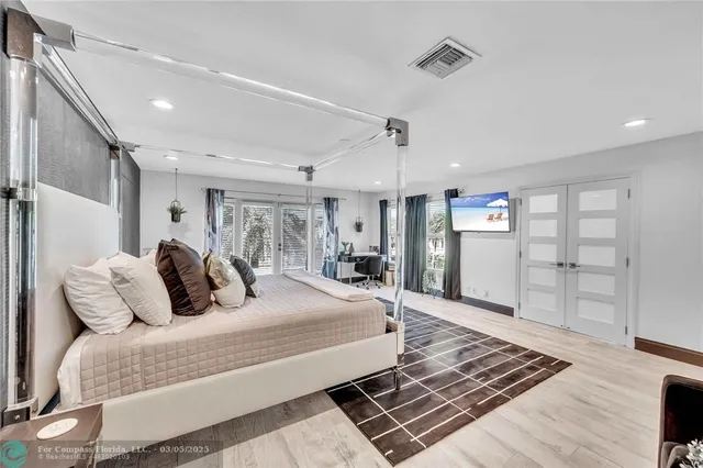 a living room with furniture a rug and a table