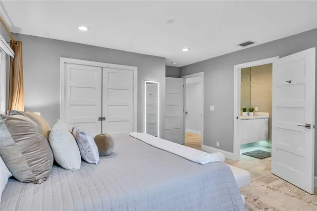 a view of bedroom with furniture and chandelier