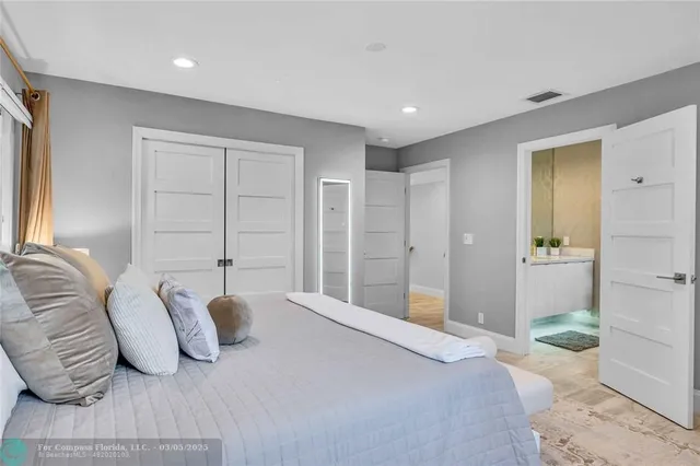 a bathroom with a sink a toilet and shower curtain