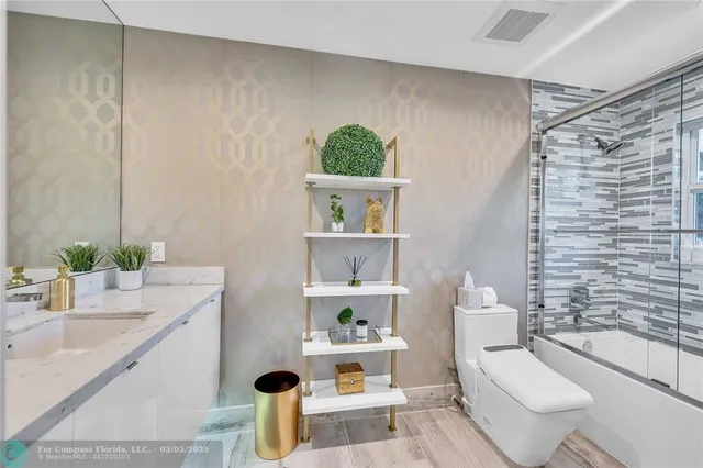 a bed room with a bed and a chandelier