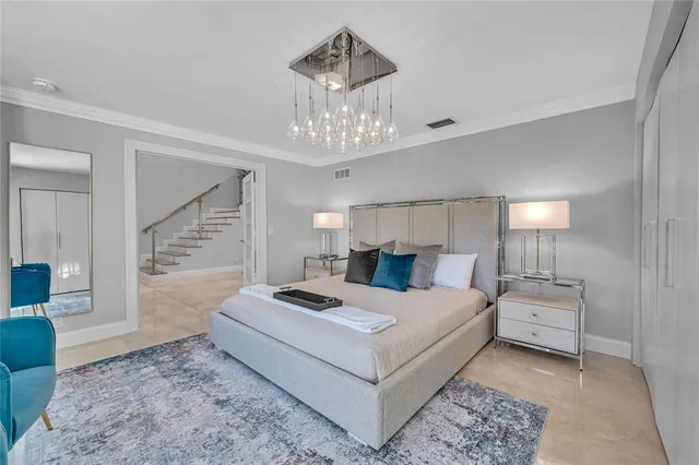 a bedroom with bed and window