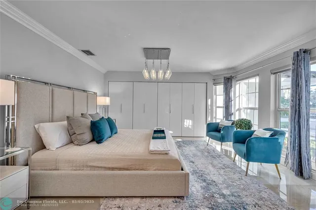 a bedroom with bed and wooden floor