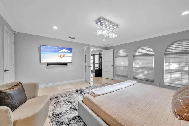 a bedroom with a bed and a couch