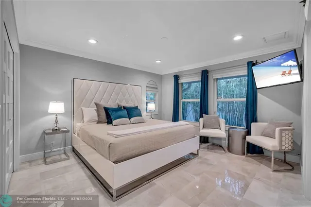 a bedroom with a bed and a couch