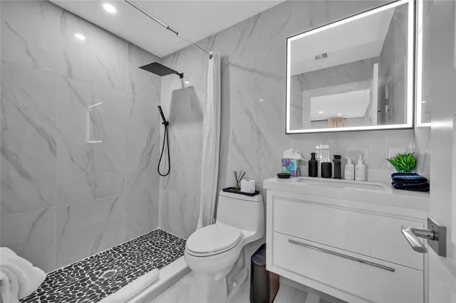 a spacious bedroom with a bed and a large window