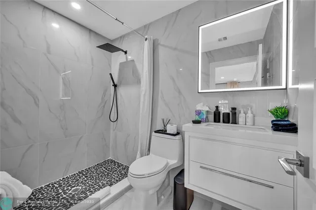 a bedroom with a large bed and window