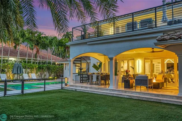 a view of swimming pool with a garden and plants