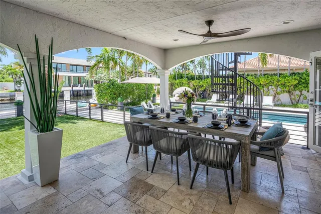 a view of swimming pool with outdoor seating and a garden