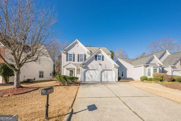a view of house with yard