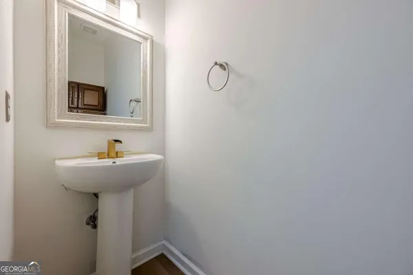 a bathroom with a sink and mirror