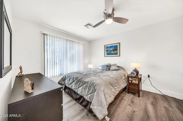 a kitchen with stainless steel appliances granite countertop a sink a stove top oven a counter space and cabinets