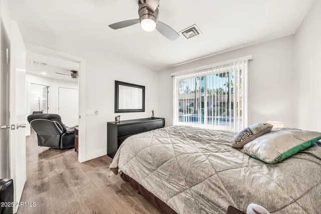 a bed room with a bed and a chandelier