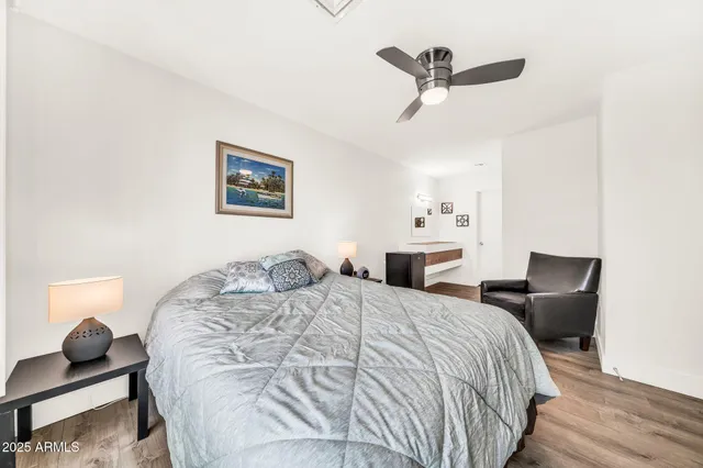 a bedroom with a bed and a couch