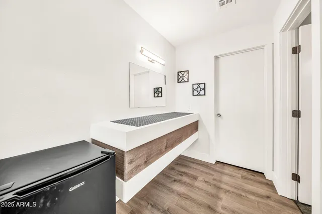 a bedroom with bed and window