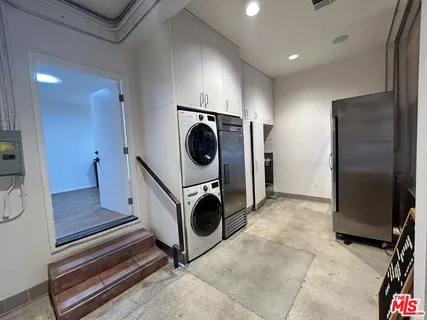 a kitchen with a washer and dryer