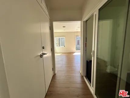 a bathroom with a sink toilet a window and vanity