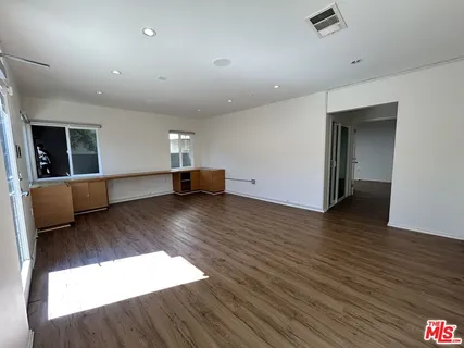 a view of a livingroom with wooden floor