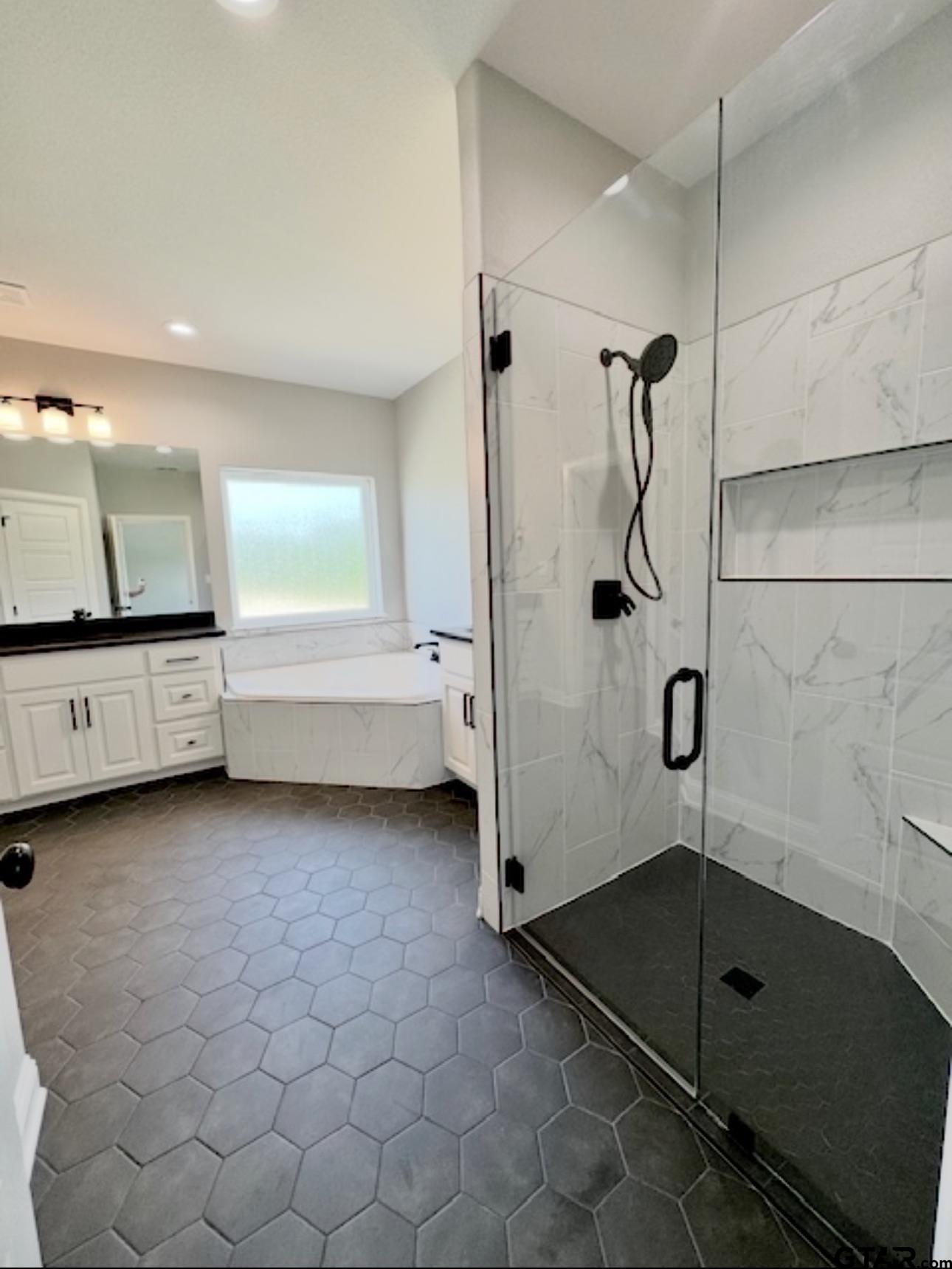 349 Brooks Jefferson, TX 75657 - Photo 14 of 23 a bathroom with a tub and a shower