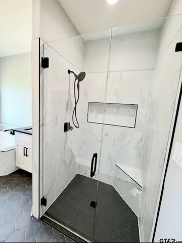 an empty room with windows and entrance