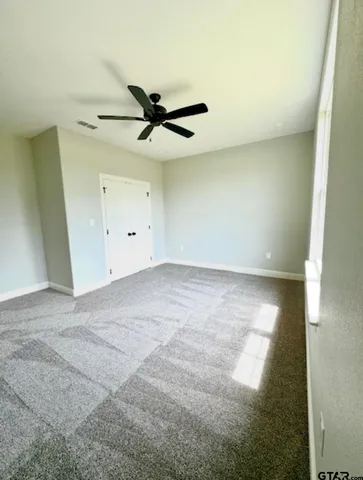 a kitchen with granite countertop white cabinets and sink