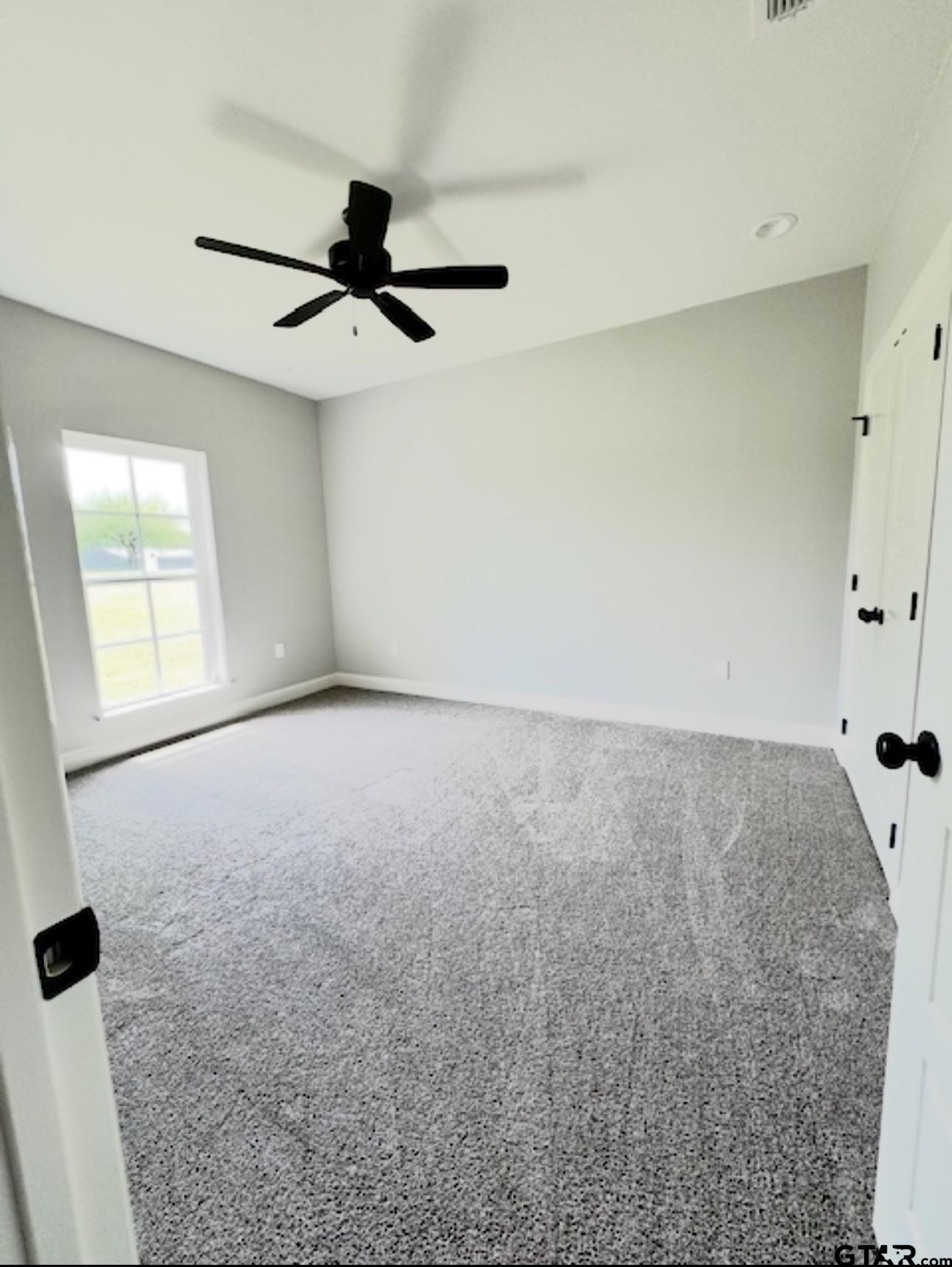 349 Brooks Jefferson, TX 75657 - Photo 19 of 23 an empty room with windows