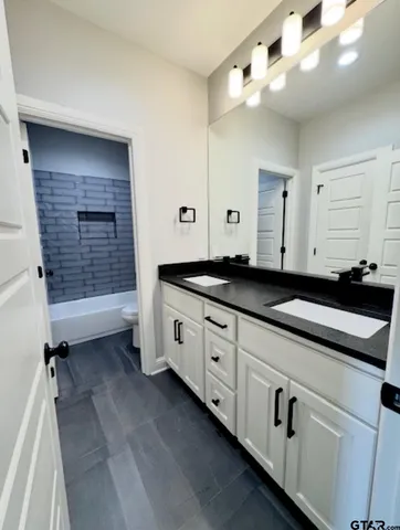 an empty room with a ceiling fan and window