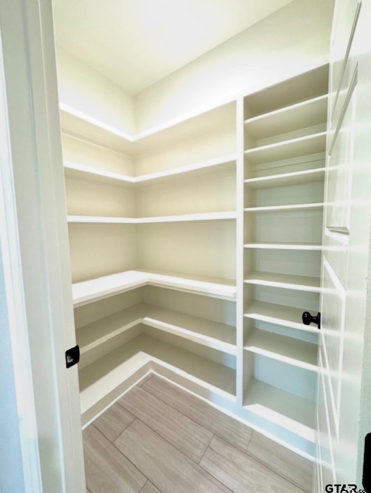 349 Brooks Jefferson, TX 75657 - Photo 10 of 23 a view of walk in closet with empty racks