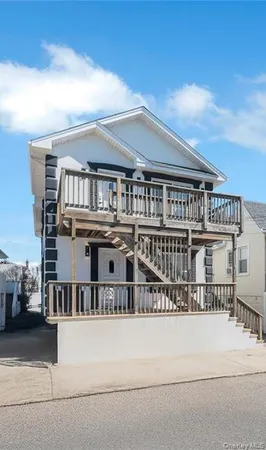 a view of a white building among the ocean