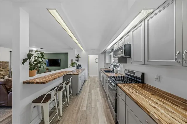 a bedroom with furniture and a wooden floor